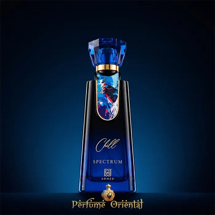 Hero shot of Chill Spectrum Eau de Parfum by Ahmed Al Maghribi, featuring a striking blue glass unisex perfume bottle with an abstract art plaque against a dark blue background