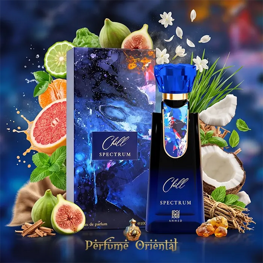 Chill Spectrum oriental unisex perfume by Ahmed Al Maghribi displayed next to its matching abstract art packaging box, surrounded by fresh fragrance ingredients including citrus, mint, and sandalwood