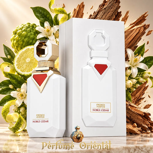 Noble Cedar de French Avenue 100 ml con su caja blanca, rodeado de bergamota, flores de azahar y madera de cedro.