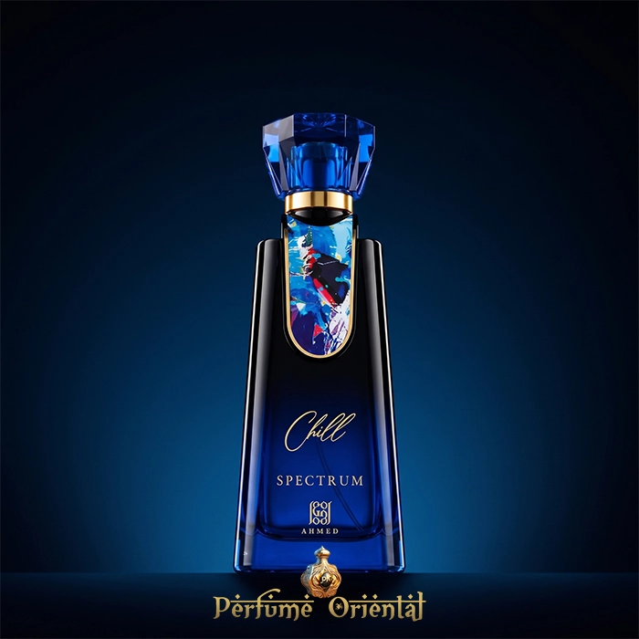 Hero shot of Chill Spectrum Eau de Parfum by Ahmed Al Maghribi, featuring a striking blue glass unisex perfume bottle with an abstract art plaque against a dark blue background