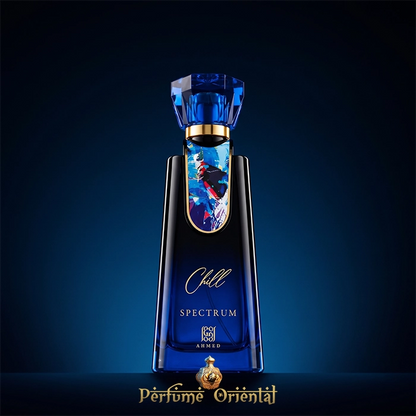 Hero shot of Chill Spectrum Eau de Parfum by Ahmed Al Maghribi, featuring a striking blue glass unisex perfume bottle with an abstract art plaque against a dark blue background