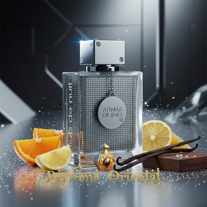 Perfume ARMAF CLUB DE NUIT BLING sobre fondo metálico con elementos de madera y cítricos