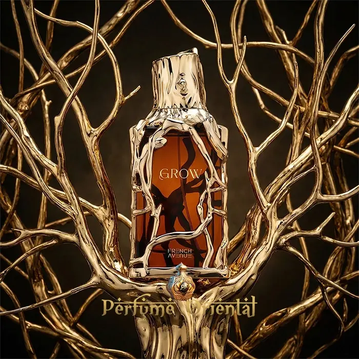 GROW French Avenue Extrait de Parfum luxury perfume bottle surrounded by golden branches artistic studio shot