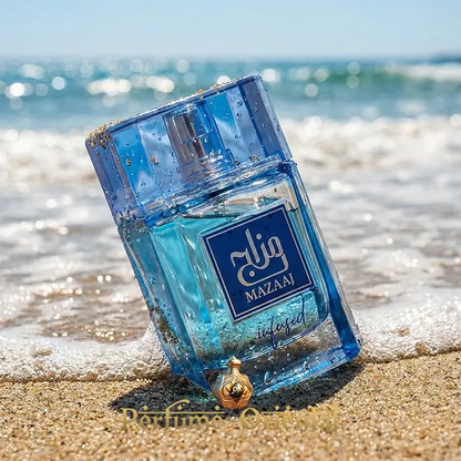 Mazaaj Infused Zimaya EDP 100ml perfume bottle on beach fresh citrus aquatic fragrance
