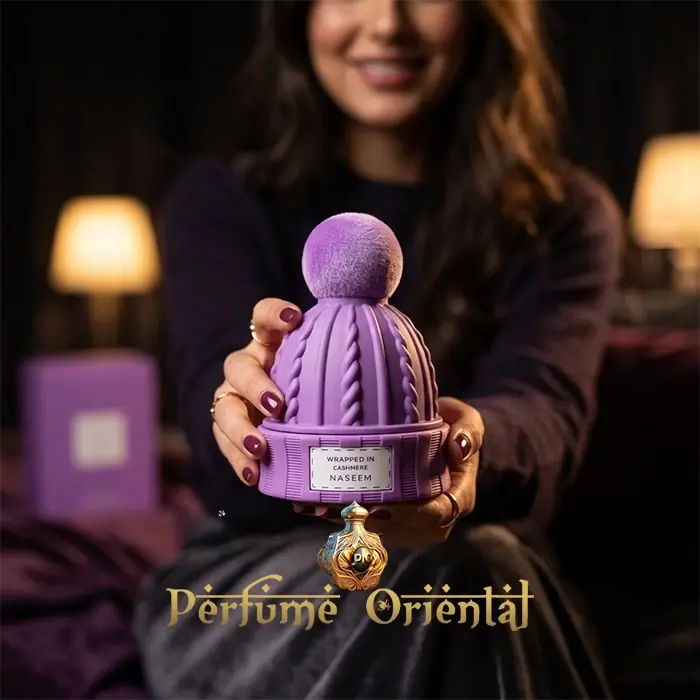 Perfume árabe Wrapped in Cashmere de Naseem 80ml sin alcohol con modelo – fragancia oriental femenina en frasco lila diseño exclusivo